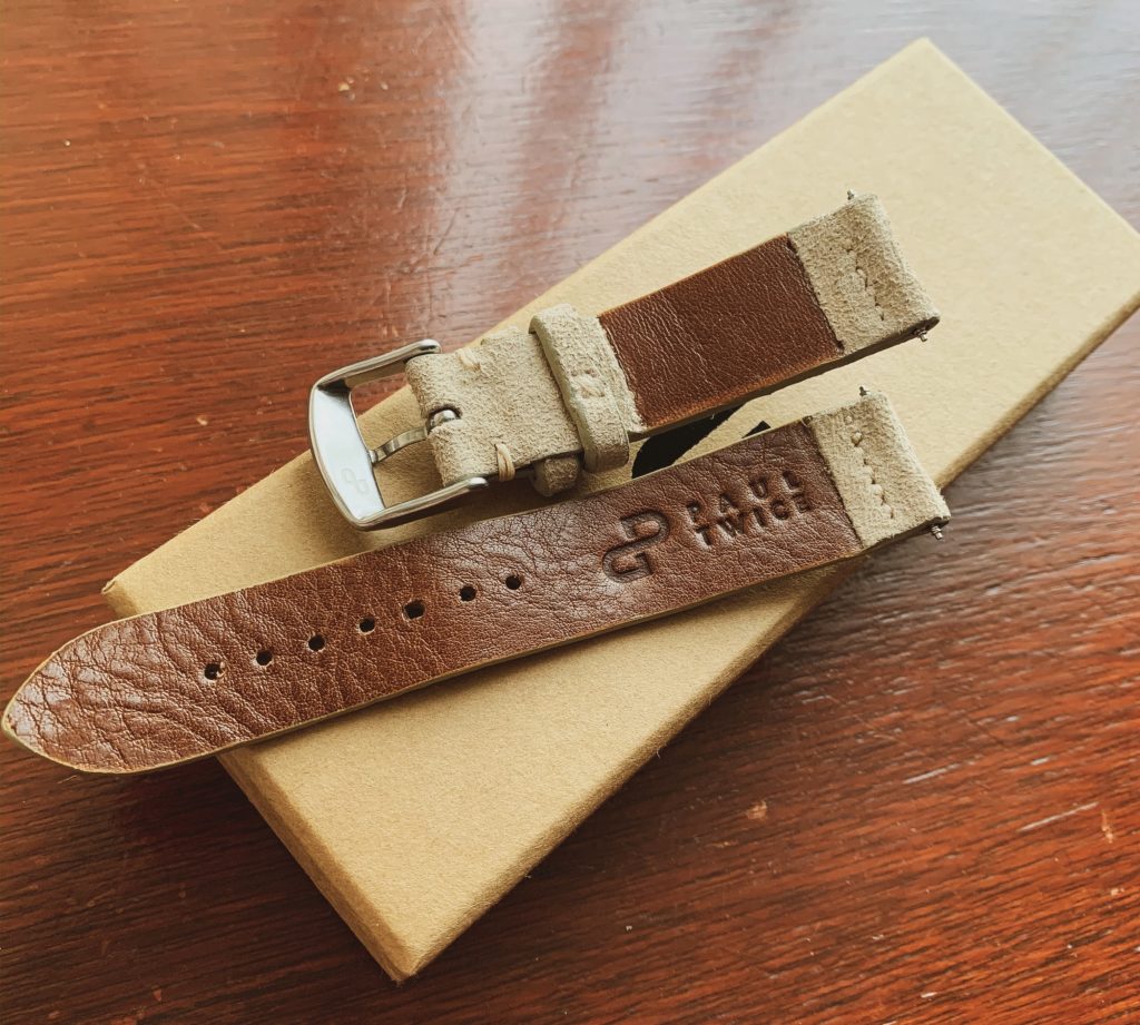 Under side of watch strap with logo