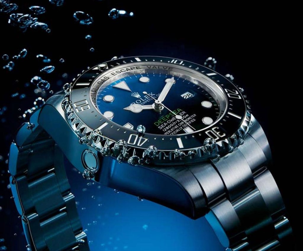 gas bubbles coming from watch under water